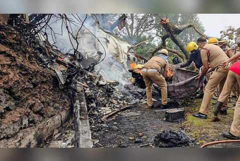 Rescue officials at the spot where IAF Mi-17V5 helicopter crashed in Coonoor (Image credit: PTI)