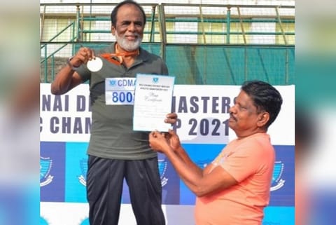 GK Reddy with the medal.