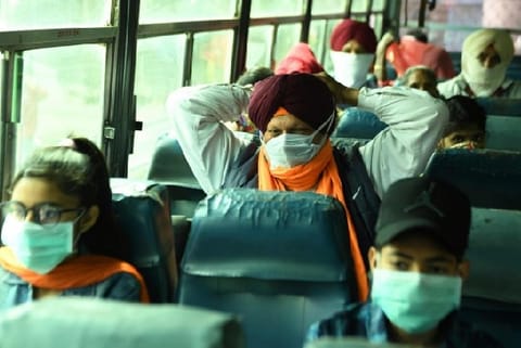 Passengers wearing facemasks amid concerns over the spread of the COVID-19 (Credit: Reuters)