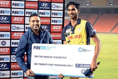 TN spinner M Siddharth with the Man of the Match award
