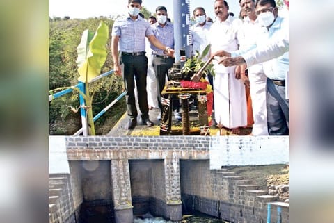 Collectors Sandeep Nanduri and Kiran Kurala opening the shutters of Sathanur Dam in Tiruvannamalai.