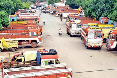 Lorries parked at a yard in view of the strike in Coimbatore on Friday