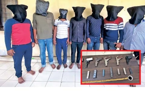 The members of the gang, (inset) arms seized