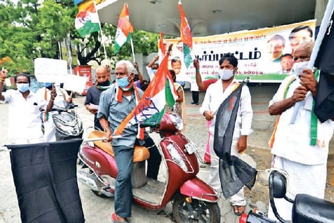 Congress workers protesting against fuel price increase in front of an outlet in Chennai on Friday