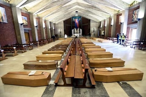 Italian priest recalls COVID-19 'nightmare' of coffin-filled church