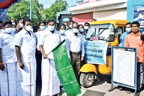 Municipal Administration Minister KN Nehru flagging off the sale of essentials from mini vans