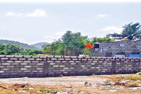 The controversial wall before being demolished by officials near Pernambut on Thursday