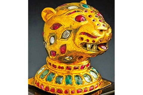 A gold jewelled tiger head