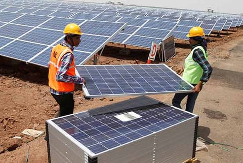 Solar powered panels installed by workers (File Photo)