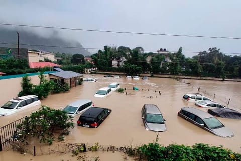Submerged cars seen at flooded resort as extreme rainfall caused Kosi River overflow in Uttarakhand