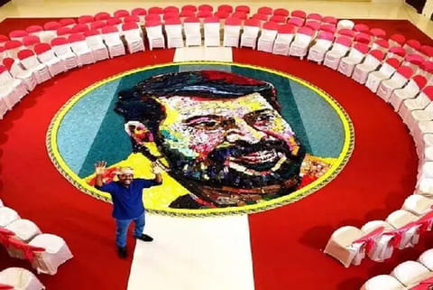 Artist DaVinci Suresh with actor Mammootty's portait (Image Credit: ANI)