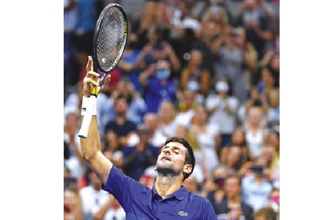 File Photo : World number one Novak Djokovic celebrates after entering the quarter-finals of the US