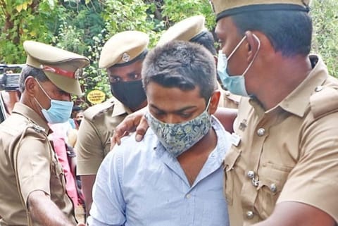 Flight lieutenant S Amitesh Harmukh being produced in the Mahila Court in Coimbatore.