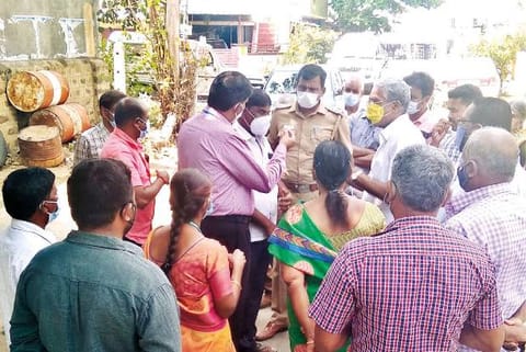 Officials holding talks with residents in Karamadai near Coimbatore on Tuesday