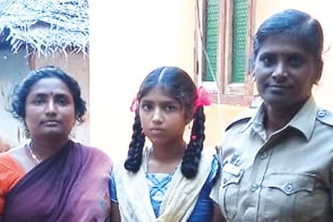 Head constable P Susila with the mother of girl whom she counselled on the need to continue studies