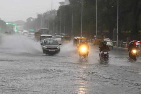Vechiles passing over a flooded road during the rains (Photo credit: Manivasagan