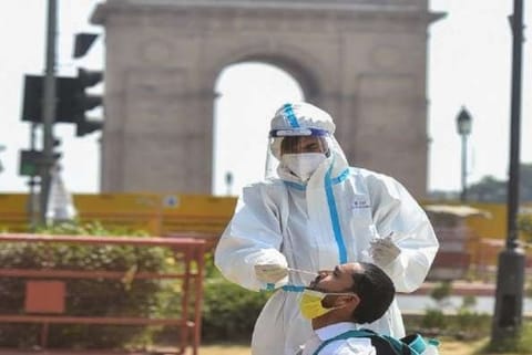 A health worker taking a swab sample (Image credit: PTI)