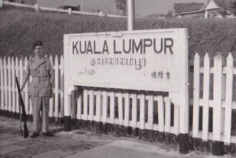 A sign board in Tamil and English at a railway station in Malaysia