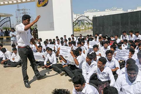 Students of Tamil Nadu Dr Ambedkar Law University staging a protest near the campus in Perungudi