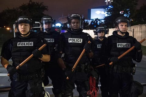 Riot police block a ramp to a highway during a demonstration against police brutality in Charlotte