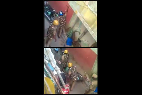 A parked two-wheeler (Top); cops vandalising the vehicle (Below)
