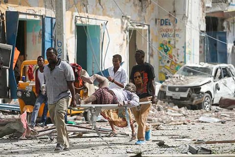 A victim being carried on stretcher