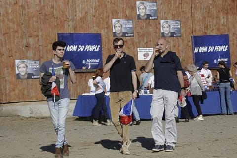 People attend a campaign meeting of French presidential election candidate for Front National Party
