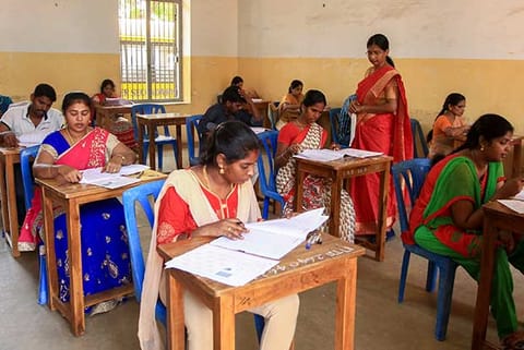 Teachers writing the TET