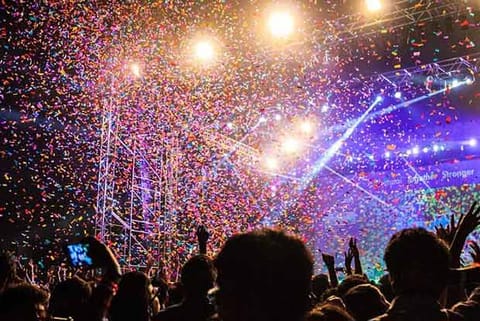 Confetti being dispersed into the audience during a rock show at Saarang organised in IIT-Madras