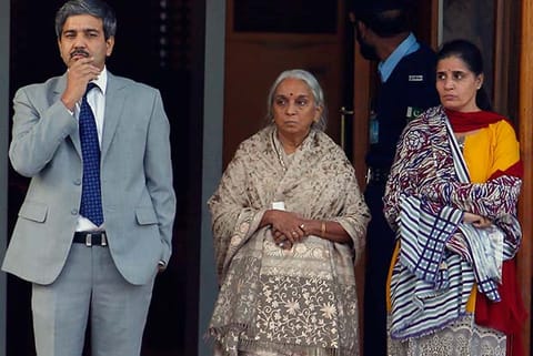 Wife (R) and mother (C) of Kulbhushan Jadhav escorted by an Indian diplomat after the meeting