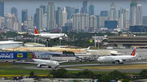 A view of Manila's Ninoy Aquino International Airport (NAIA), with the Makati skyscrapers in the background.