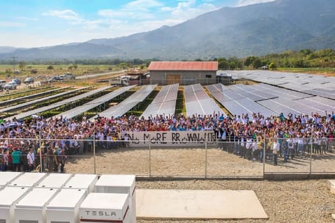 Manila's sovereign wealth fund Maharlika Investment Corp. (MIC) has partnered with Saudi Arabia's ACWA Power to electrify off-grid islands in the Philippines. The initiative targets isolated communities that rely on costly fossil generators, addressing both energy poverty and environmental concerns. Photo shows a community solar power project in Paluan town on the island of Mindoro, the first solar-plus-storage microgrid system in Asia to use Tesla’s Powerpack energy storage system installed in 2018 to end power outages on the island.