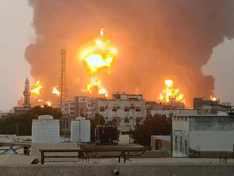 A handout picture obtained from Yemen's Houthis Ansarullah Media Centre shows a huge column of fire erupting following reported Israeli strikes in the Yemeni rebel-held port city of Hodeida.