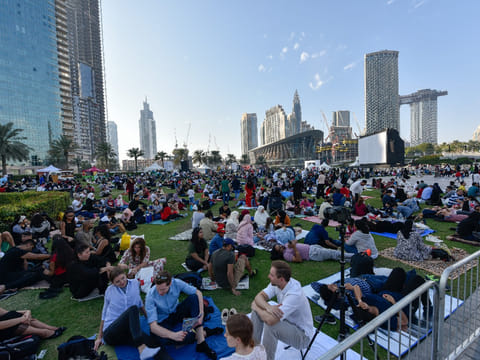 People at Burj Park gather to witness the fireworks on the New years eve in Dubai