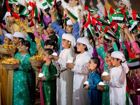Performers participate from 53rd Eid Al Etihad official show in 2024 at the base of Jebel Hafeet.
