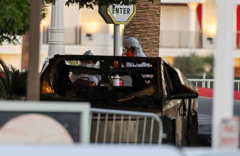 First responders wearing Hazmat gear investigate a Tesla Cybertruck that exploded in front of the entrance to the Trump International Hotel & Tower Las Vegas on January 01, 2025 in Las Vegas, Nevada.