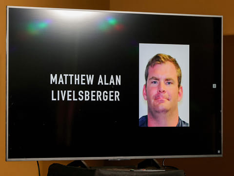 An image of Matthew Alan Livelsberger is displayed on a monitor during a news conference at Las Vegas Metropolitan Police Department headquarters about the Tesla Cybertruck that exploded on New Year's Day in front of the entrance to the Trump International Hotel & Tower Las Vegas on January 02, 2025 in Las Vegas, Nevada.