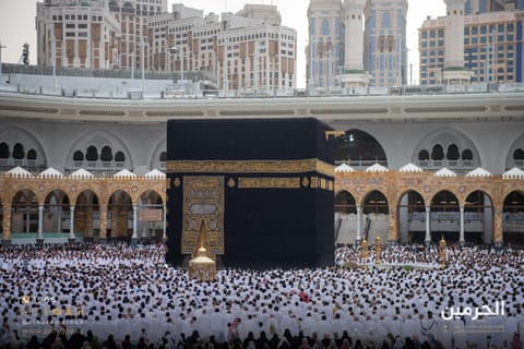 Pilgrims and worshippers throng the courtyard of the Grand Mosque, home to the Holy Kaaba.