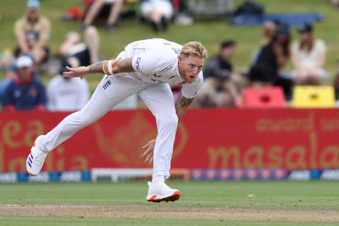 Englands Ben Stokes bowls on day three of the third cricket Test match against New Zealand and England at Seddon Park in Hamilton on December 16.