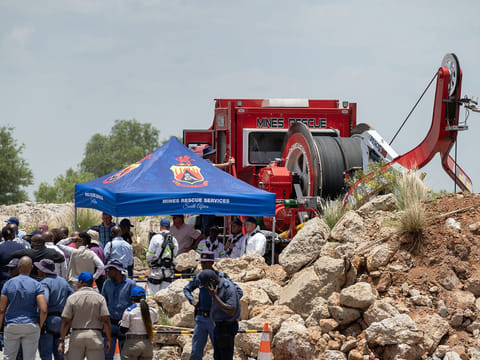 Mines rescue services and police during rescue operations at the abandoned Buffelsfontein gold mine in Stilfontein, South Africa, on Tuesday, Jan. 14, 2025.