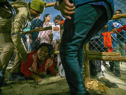 A devotee at the site of a stampede amid the ongoing Maha Kumbh Mela festival in Prayagraj on January 29, 2025.