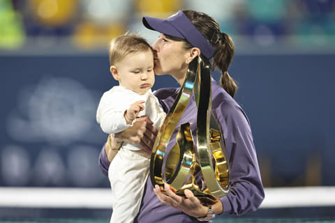 TOPSHOT - Switzerland's Belinda Bencic celebrates with her daughter after defeating Ashlyn Krueger of the US during the women's final at the Abu Dhabi Open tennis tournament on February 8.