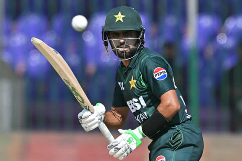 Pakistan's Babar Azam watches the ball after playing a shot during the Tri-Nation series final one-day international (ODI) cricket match between Pakistan and New Zealand at the National Stadium in Karachi on February 14, 2025.