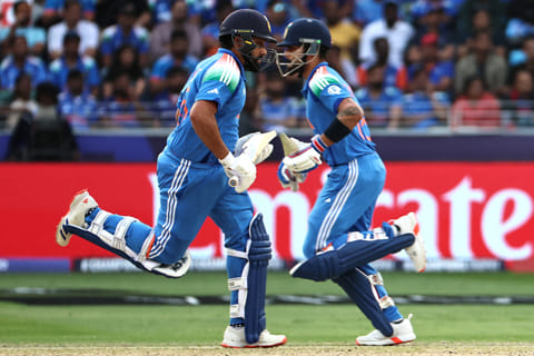 India's captain Rohit Sharma (L) and teammate Virat Kohli run between the wickets during the ICC Champions Trophy one-day international (ODI) semi-final cricket match between Australia and India at the Dubai International Stadium in Dubai on March 4, 2025.