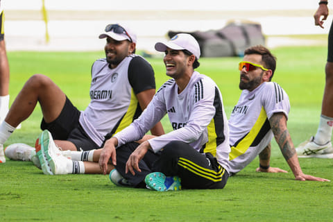India's Shubman Gill (centre), Virat Kohli (right) and Harshit Rana having a laugh during a practice session ahead of the Champions Trophy final at Dubai International Stadium.