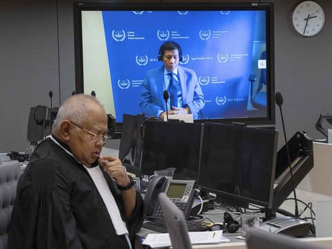 Former Philippine president Rodrigo Duterte appears in a video-conference as he skipped an in-person attendance during the initial hearing at the International Criminal Court (ICC).