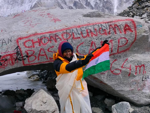Vasanthi Cheruveettil waves the Indian flat at the Everest Base Camp.