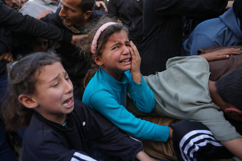 Relatives mourn Palestinian journalist Hussam Shabat, who collaborated with Al Jazeera Mubasher, during his funeral at the Indonesian Hospital in Beit Lahia, northern Gaza Strip, on March 24, 2025.