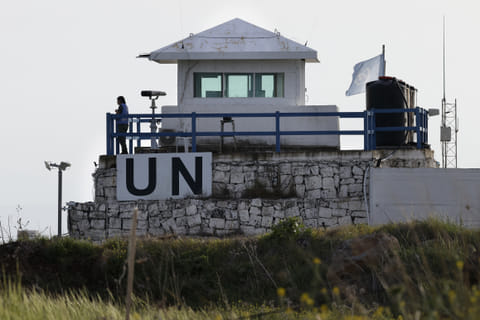A member of the United Nations UN peace forces stands at a watchtower overlooking south Syria in the Israel-annexed Golan Heights, on March 25, 2025.