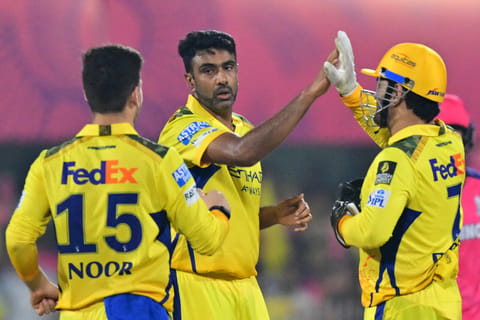 Chennai Super Kings' Ravichandran Ashwin (centre) celebrates with teammates Mahendra Singh Dhoni (right) and Noor Ahmad during the Indian Premier League 2025.